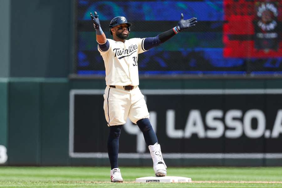 Minnesota Twins first baseman Carlos Santana celebrates after a two-run double