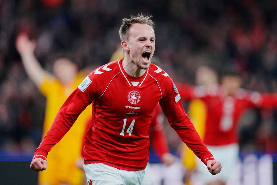 Mikel Damsgaard celebrates after scoring for Denmark