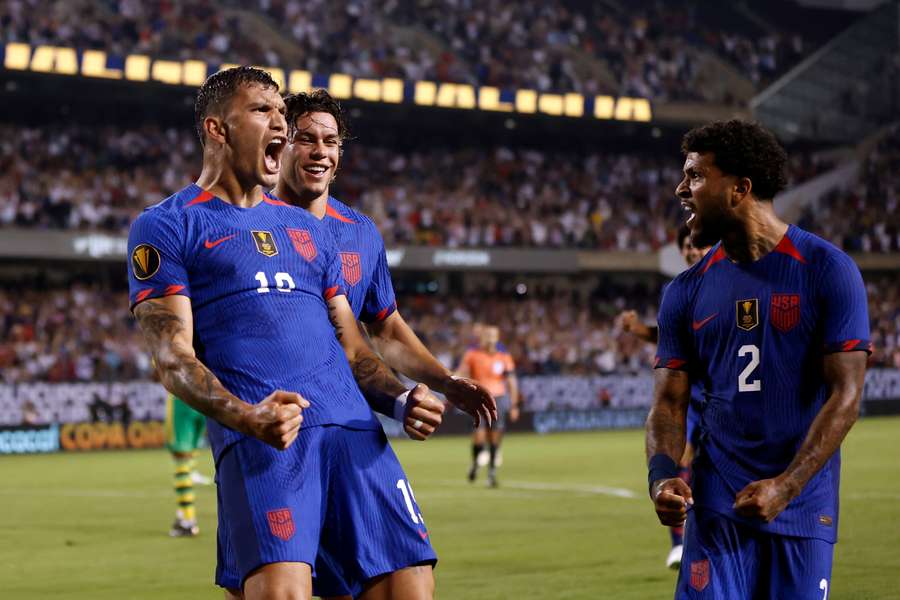 Vazquez (L) celebrates his late equaliser