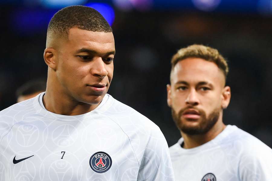 Kylian Mbappe and Brazilian forward Neymar warm up prior to PSG's Champions League match against Benfica.