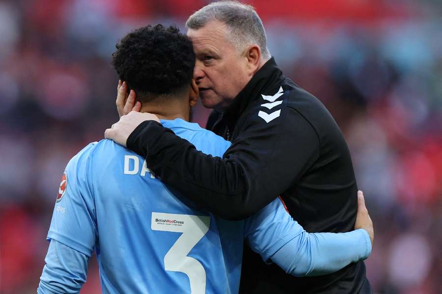 Jay Da Silva and manager Mark Robins look dejected after losing the penalty shootout