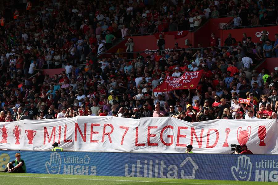 Liverpool fans display a banner in honour of Liverpool's English midfielder James Milner ahead of the English Premier League football match between Southampton and Liverpool at St Mary's Stadium