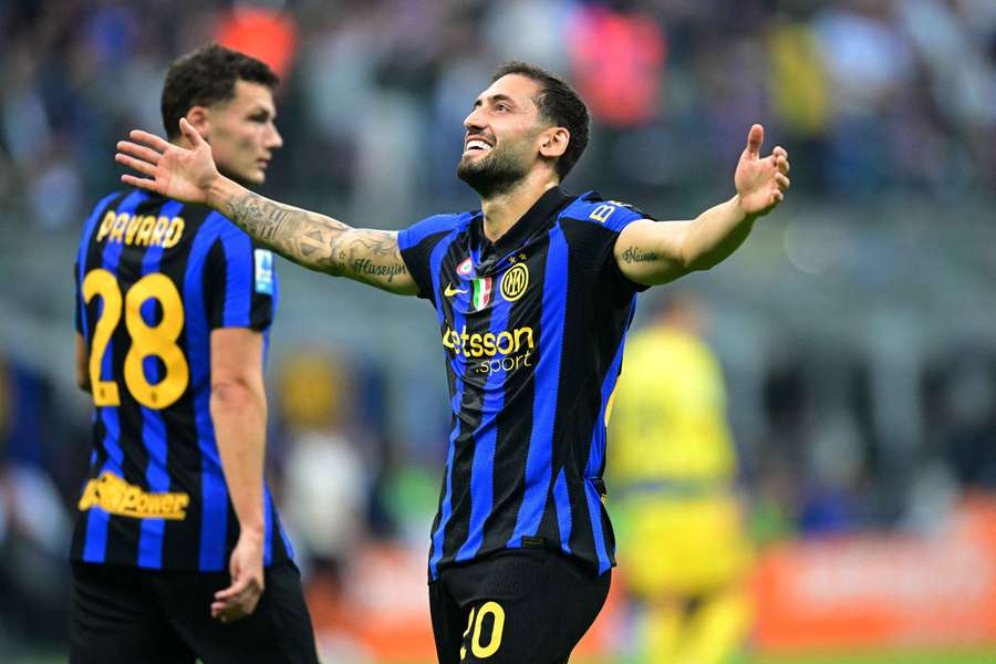 Hakan Calhanoglu celebrates scoring Inter's second goal Hakan Calhanoglu celebrates scoring Inter's second goal
