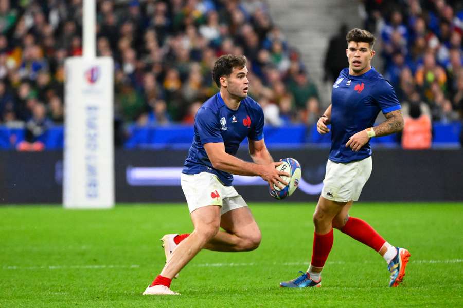 Matthieu Jalibert (L) in action for France at the 2023 Rugby World Cup.