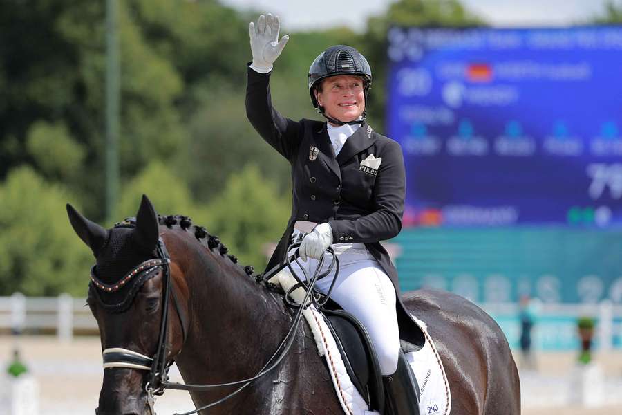  Isabell Werth salutes the crowd after taking gold for Germany