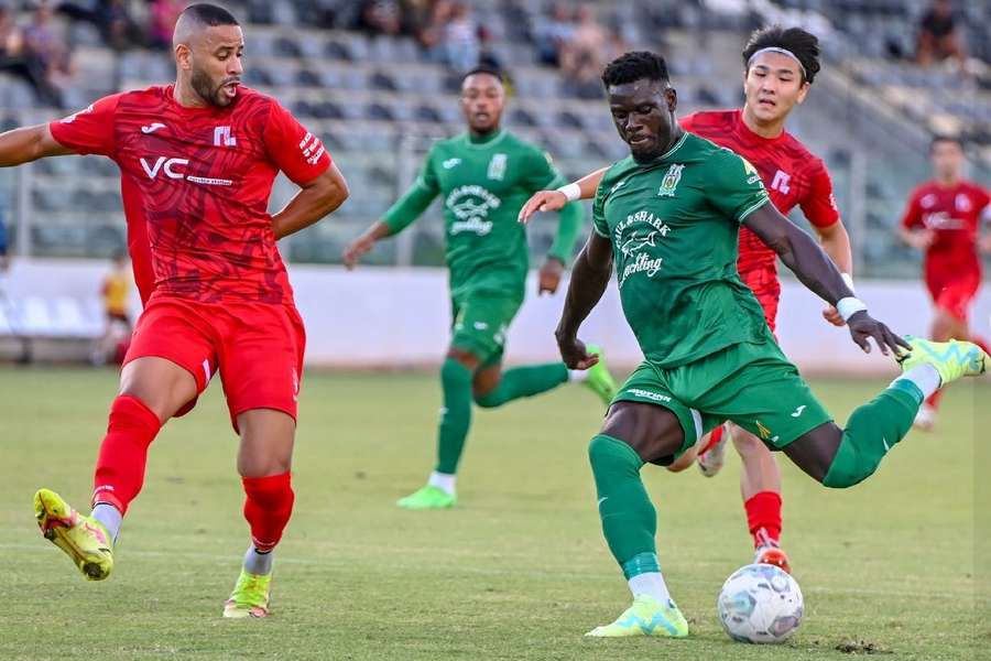 Nigeria striker Franklin Sasere (R) in action 