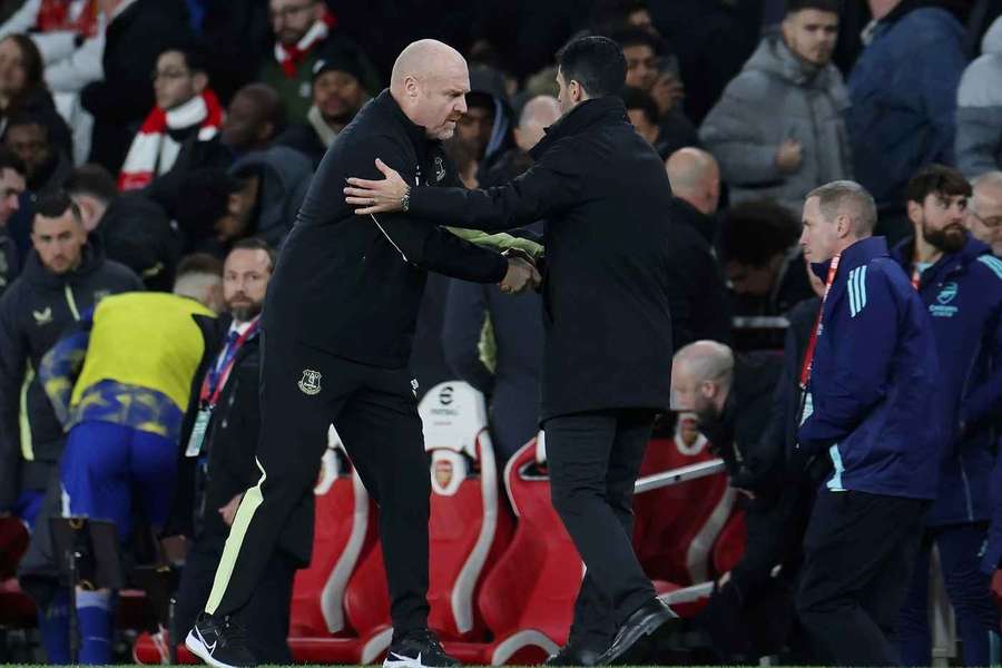 Everton's manager Sean Dyche (L) and Arsenal's manager Mikel Arteta (R) shake hands after the match