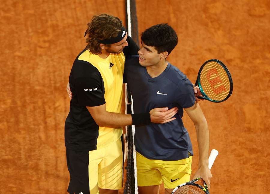 Carlos Alcaraz embraces Stefanos Tsitsipas after the match