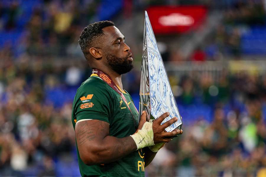 Siya Kolisi with the 'Greatest Rivalry' trophy for defeating New Zealand.