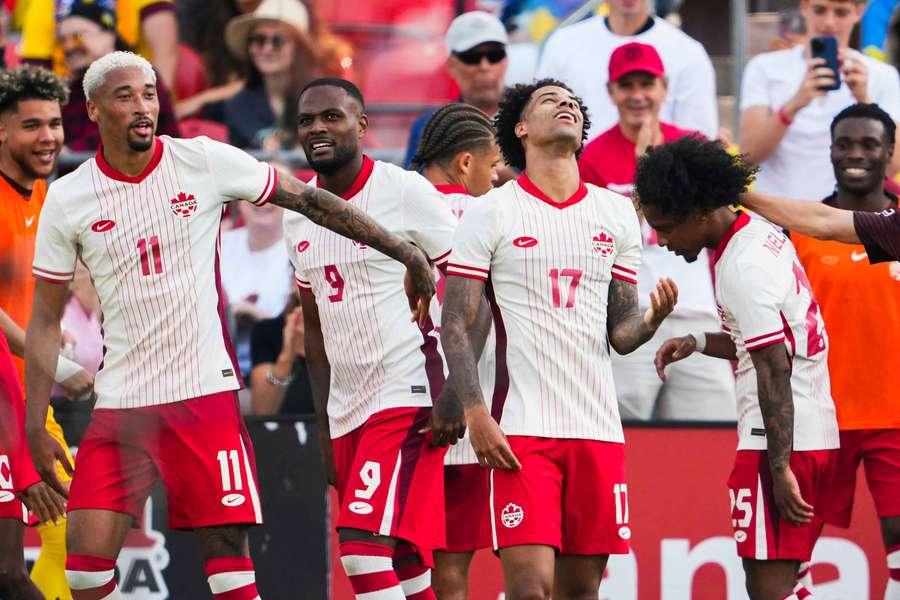 Canada celebrate a goal during their 4-2 win over Ukraine on Saturday.