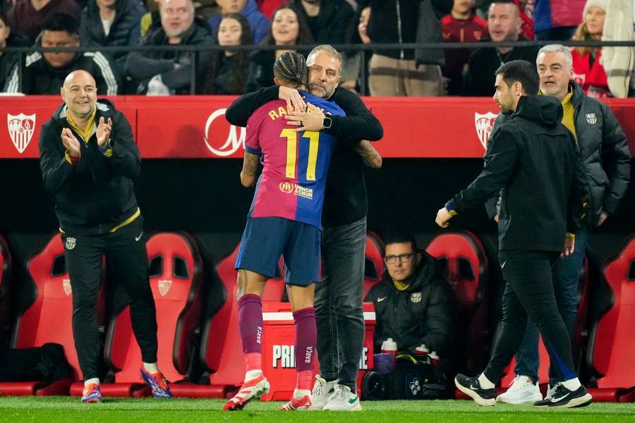 Flick and Raphinha embrace after the Brazilian's goal