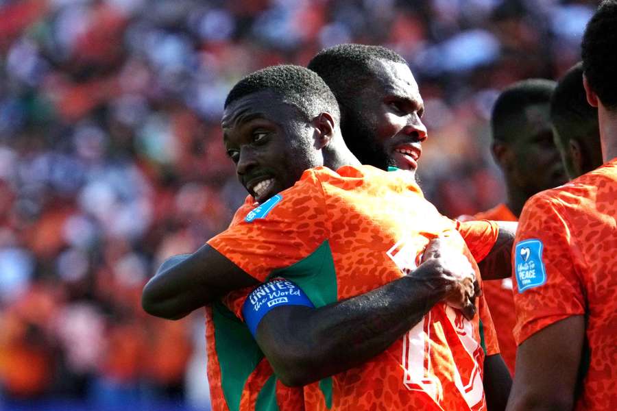 Pepe (R) celebrates scoring for the Ivory Coast
