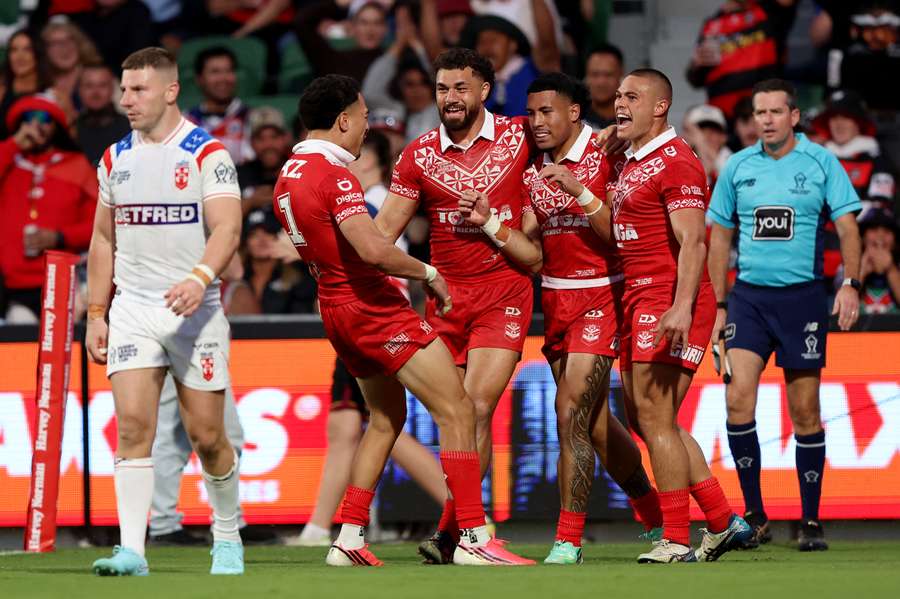 Tolutau Koula celebrates with teammates after scoring Tolutau Koula celebrates with teammates after scoring