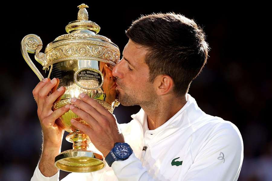 Novak Djokovic with the trophy after winning Wimbledon last year