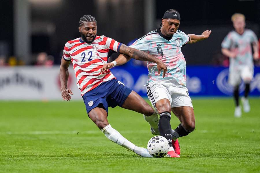USA’s Mark McKenzie and Belgium’s Lois Openda fight for the ball at Mercedes-Benz Stadium