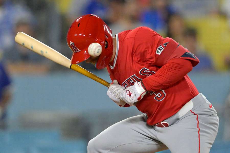 Los Angeles Angels left fielder Taylor Ward is hit by a pitch in the 10th inning against the Los Angeles Dodgers