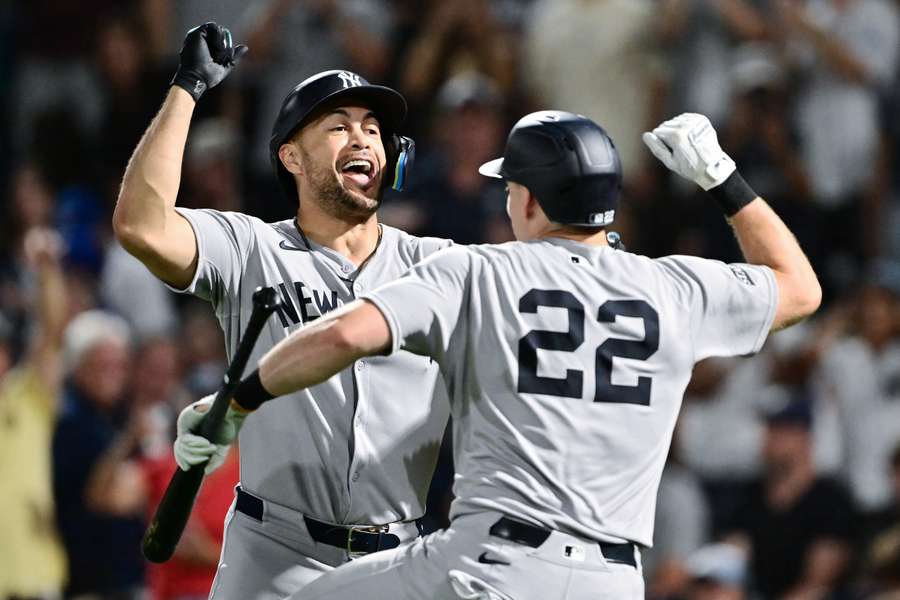 Yankees' Giancarlo Stanton (left) celebrates after Ben Rice (right) after hitting a home run (2025)