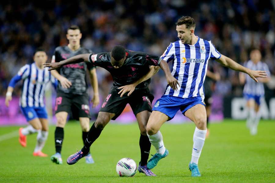 Gonzalez battles for the ball