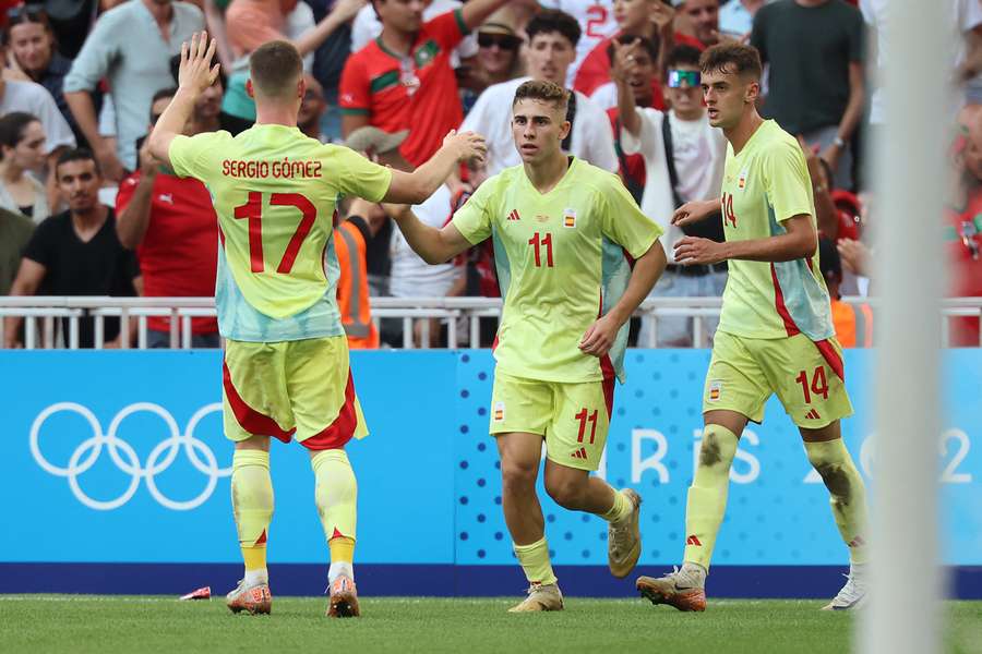 Spain celebrate Lopez's equaliser