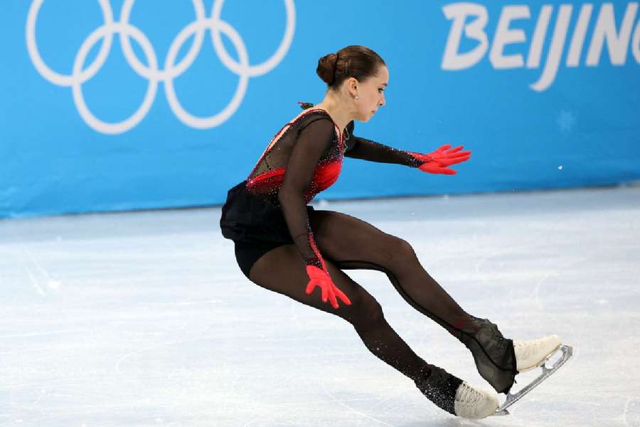 Kamila Valieva of the Russian Olympic Committee falls during her performance.