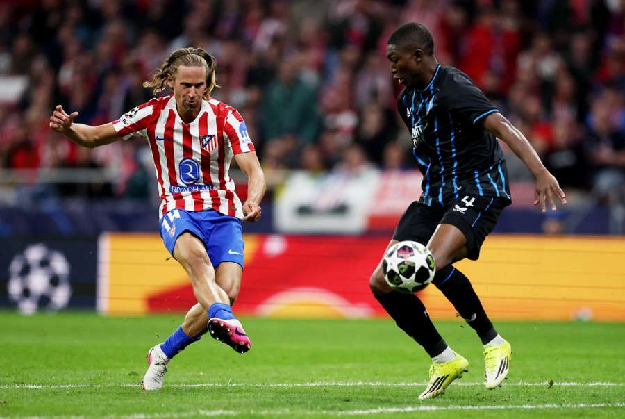 Club Brugge's Joel Ordonez in action against Atletico Madrid's Marcos Llorente in the Champions League