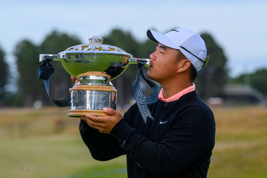 Tom Kim kisses the trophy following day four of the Scottish Open at The Renaissance Club Tom Kim kisses the trophy following day four of the Scottish Open at The Renaissance Club