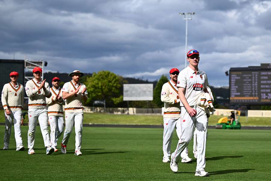 Brendan Doggett leads his South Australian teammates off the field after claiming a five-wicket haul against Tasmania. Brendan Doggett leads his South Australian teammates off the field after claiming a five-wicket haul against Tasmania.