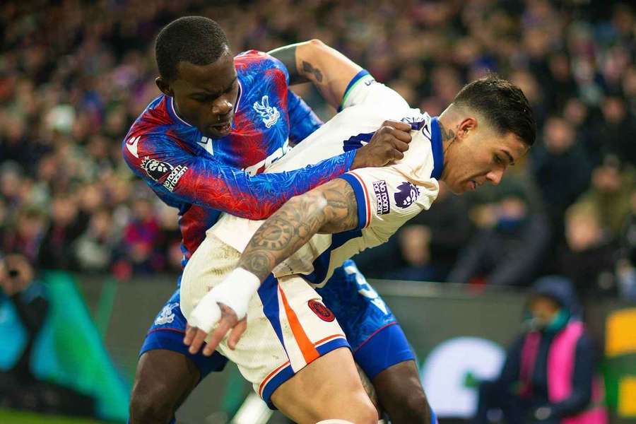 Enzo Fernández of Chelsea holds off Tyrick Mitchell of Crystal Palace Crystal Palace