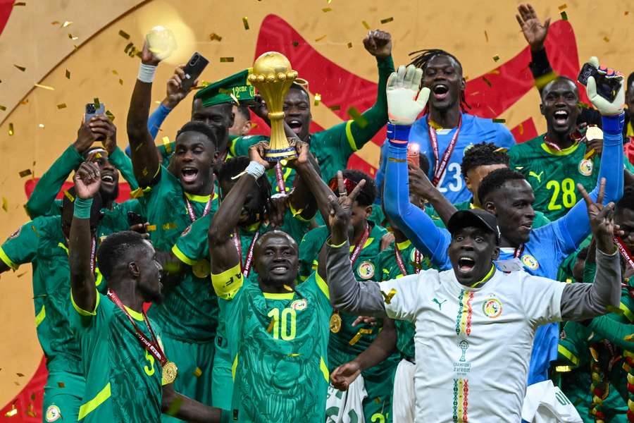 Senegal's Sadio Mane holds the trophy aloft after winning AFCON 2025