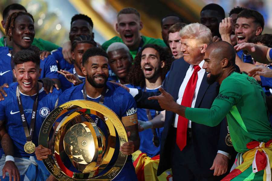 Chelsea's Reece James and teammates celebrate with the trophy alongside US President Donald Trump after winning the FIFA Club World Cup