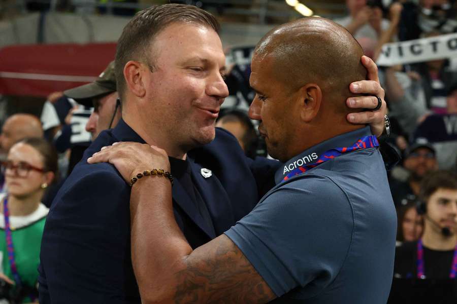 Arthur Diles and Patrick Kisnorbo embrace after their hard-fought A-League Elimination Final.