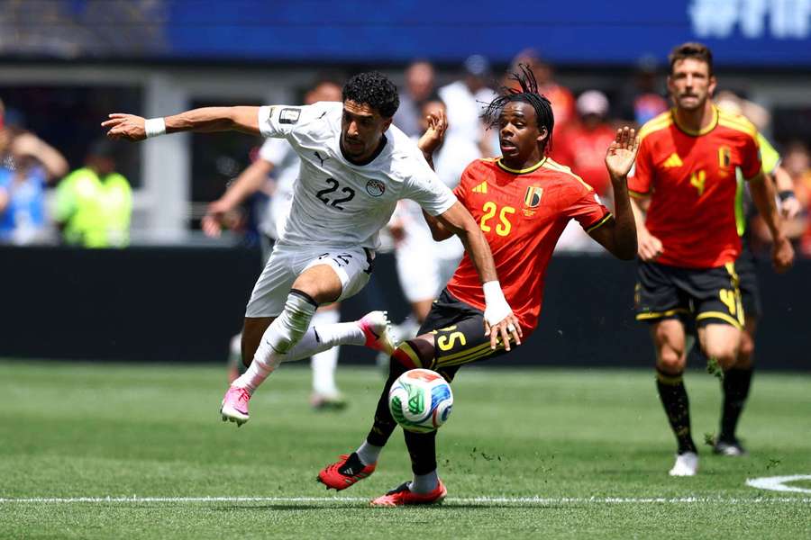 Egypt's Omar Marmoush in action with Belgium's Nathan Ngoy