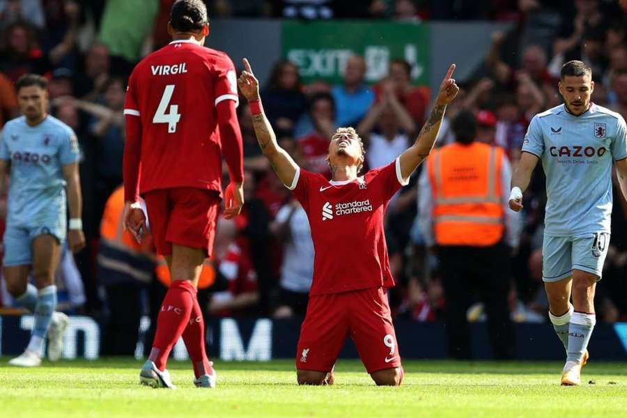 Roberto Firmino celebrates scoring his final goal for Liverpool at Anfield