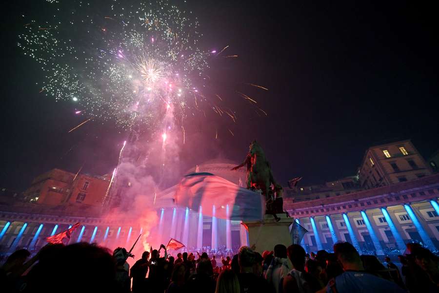 Napoli fans celebrate with fireworks on Piazza del Plebiscito