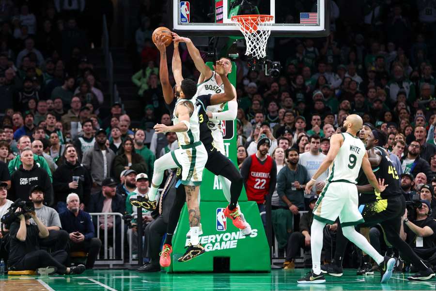 Boston Celtics forward Jayson Tatum (0) and Boston Celtics centre Kristaps Porzingis (8) block Indiana Pacers center Myles Turner back in January