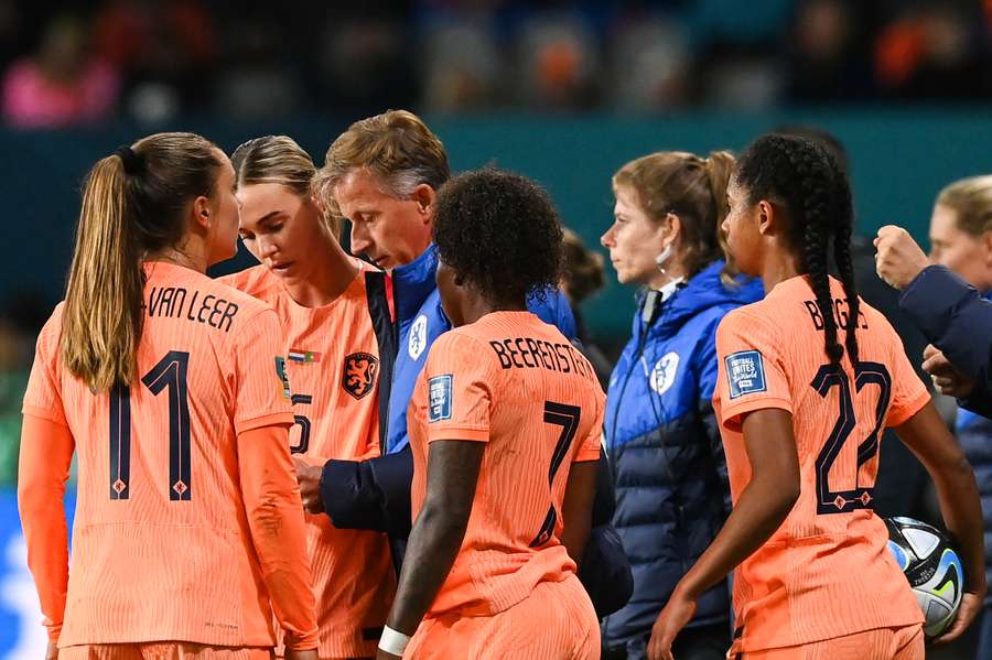 Netherlands' players receive instructions from coach Andries Jonker