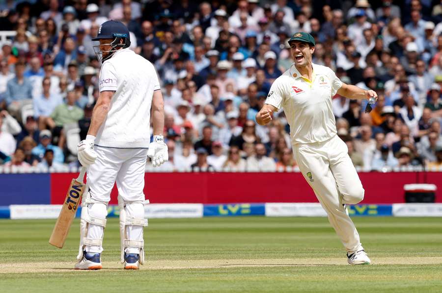 Australia's Pat Cummins celebrates taking the wicket of England's Jonny Bairstow for 10 runs on day five