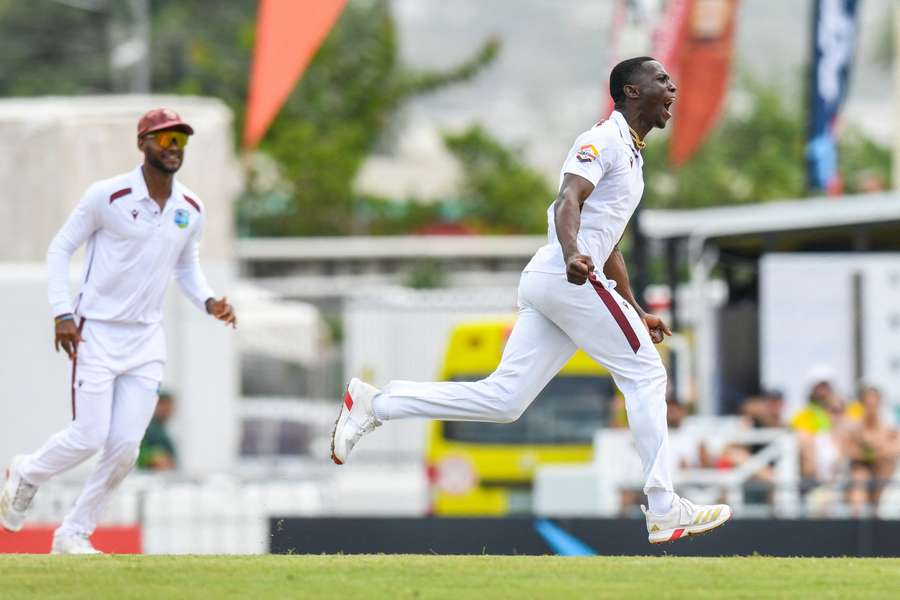 Shamar Joseph (right) of the West Indies celebrates the dismissal of Cameron Green of Australia Shamar Joseph (right) of the West Indies celebrates the dismissal of Cameron Green of Australia