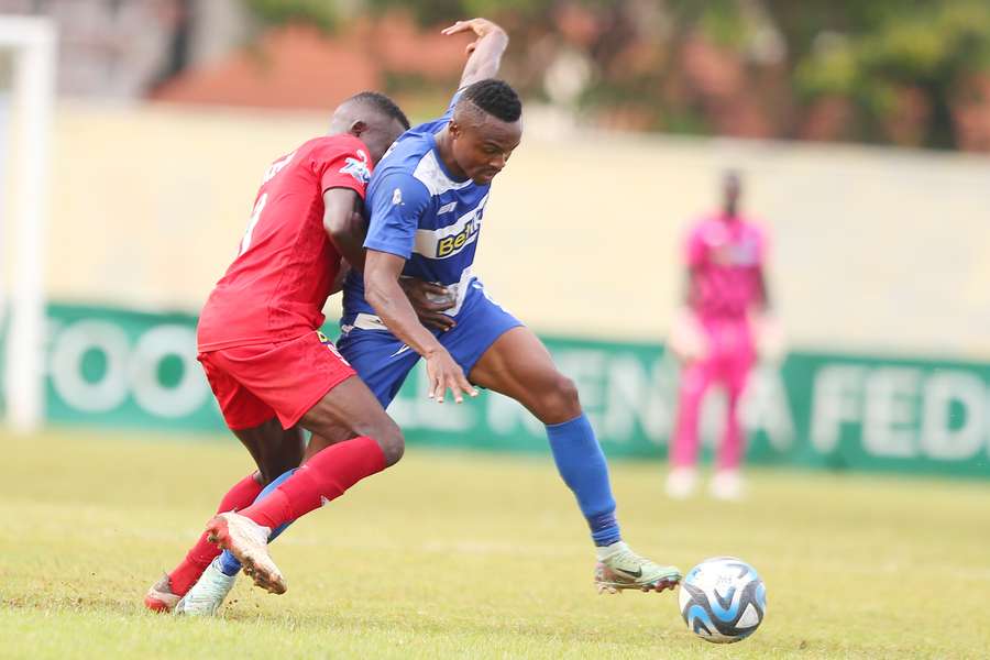 AFC Leopards midfielder Clifton Miheso (right) takes on a Kenya Police player