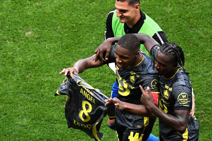 Opening goalscorer Bafode Diakite celebrates with Angel Gomes' shirt