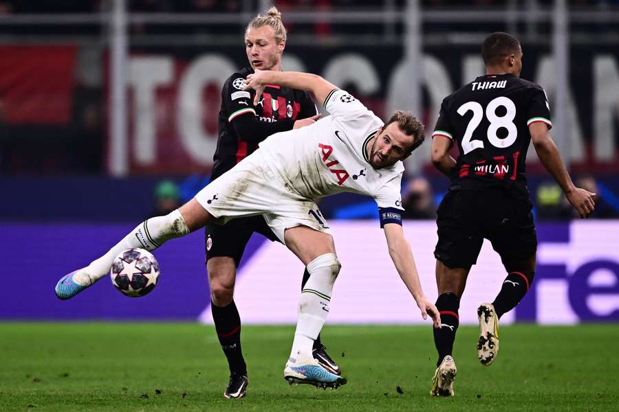 Harry Kane and Simon Kjaer battle for the ball