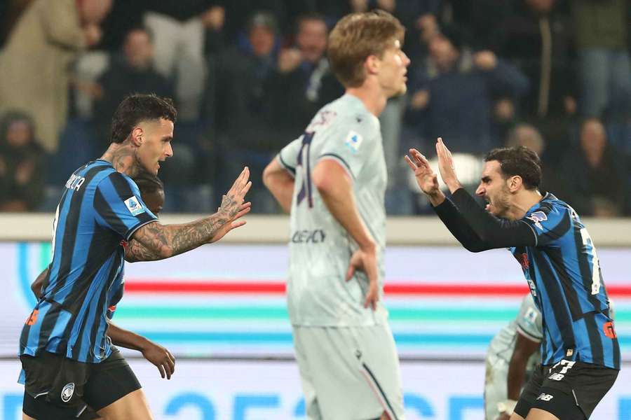 Gianluca Scamacca of Atalanta celebrates with his teammate Davide Zappacosta after scoring