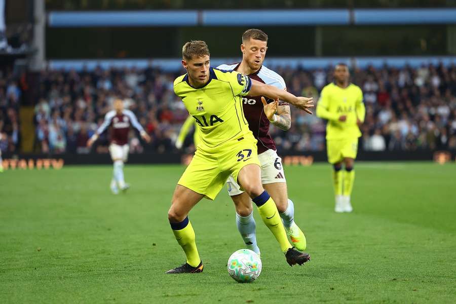 Tottenham's Micky van de Ven shields the ball from Aston Villa's Ross Barkley Tottenham's Micky van de Ven shields the ball from Aston Villa's Ross Barkley