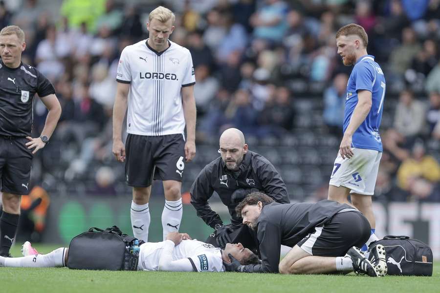Championship game stopped after Derby striker Henrik Meister collapsed as medics rush on Championship game stopped after Derby striker Henrik Meister collapsed as medics rush on