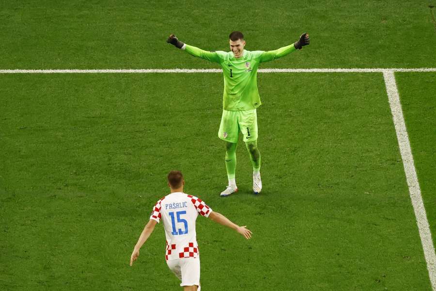 Mario Pasalic celebrates with penalty hero Dominik Livakovic