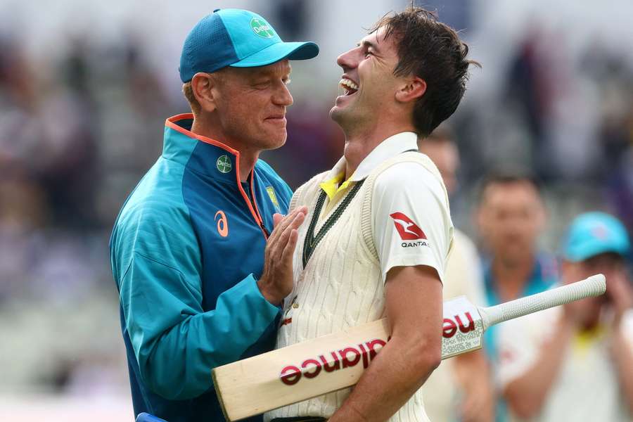 Andrew McDonald, left, with Pat Cummins after victory in the first test of the Ashes series