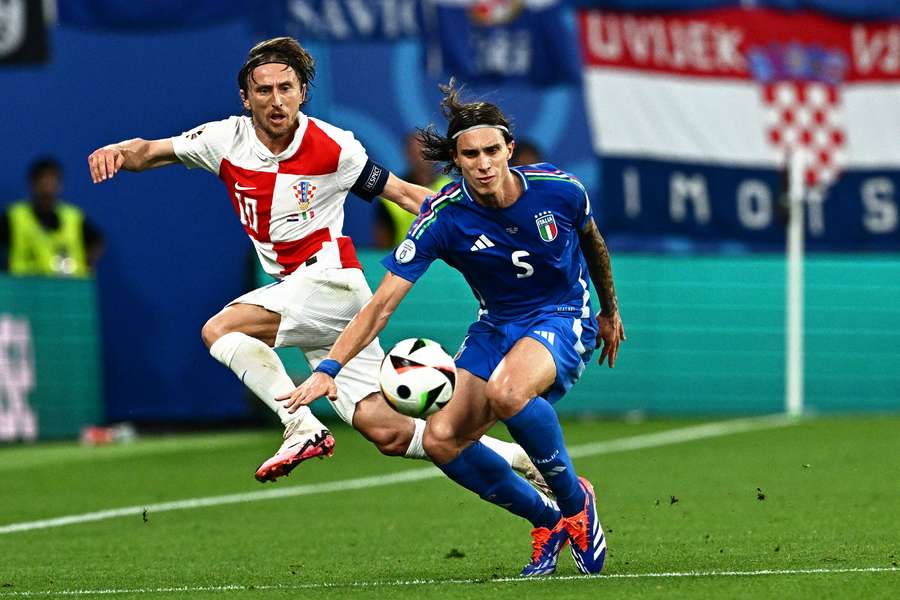 Croatia's midfielder #10 Luka Modric and Italy's defender #05 Riccardo Calafiori fight for the ball