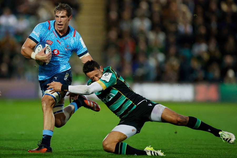 Vodacom Bulls' Cameron Hanekom in action with Northampton Saints' Alex Mitchell