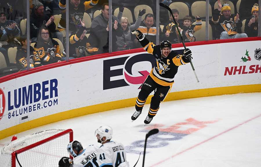 Crosby celebrates his anniversary goal. Crosby celebrates his anniversary goal.