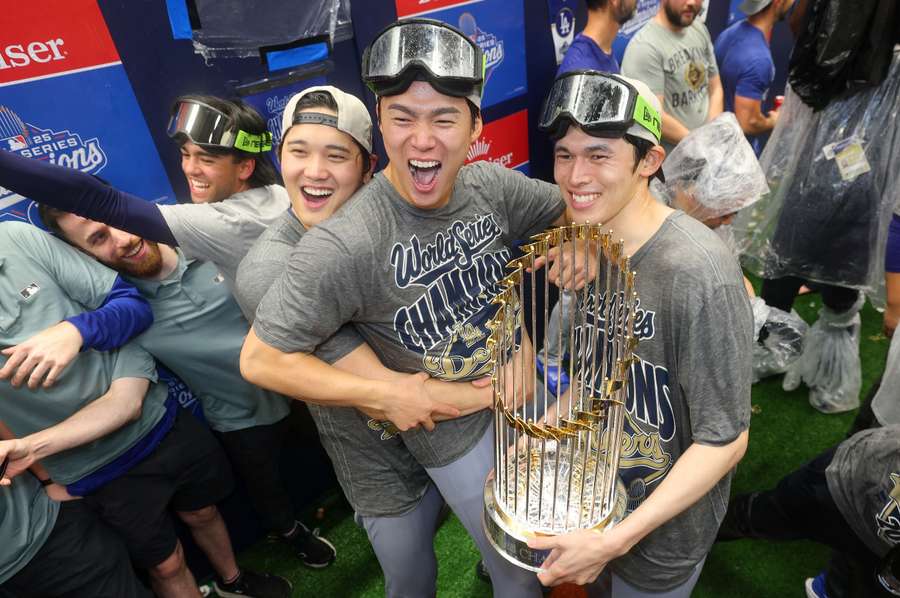 Shohei Ohtani (left), Yoshinobu Yamamoto (center), and Roki Sasaki (right) celebrate their 2025 World Series victory Shohei Ohtani (left), Yoshinobu Yamamoto (center), and Roki Sasaki (right) celebrate their 2025 World Series victory